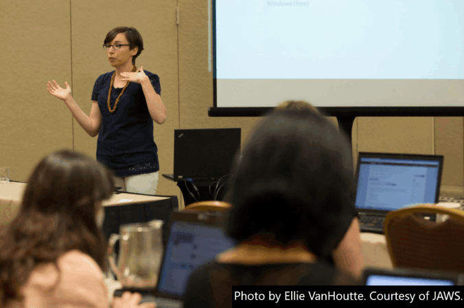 Stephanie speaking at a Conference